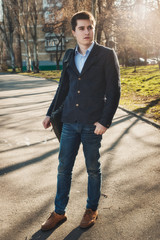 Full-lenght portrait of man standing in the city street