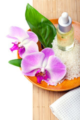 Obraz na płótnie Canvas Spa setting with orchids, aromatherapy concept