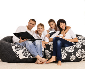 Family of four with laptop