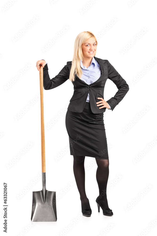 Poster Businesswoman holding a shovel