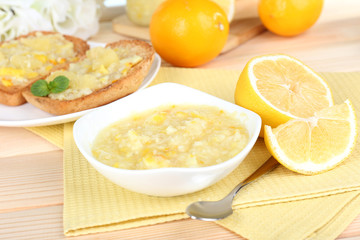 Tasty lemon jam on table close-up