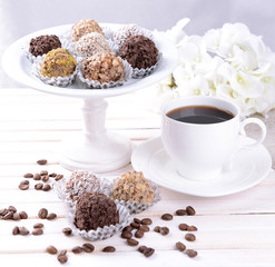 Set of chocolate candies on table on light background