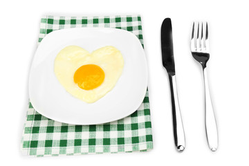 Scrambled eggs with bread on plate, on color napkin