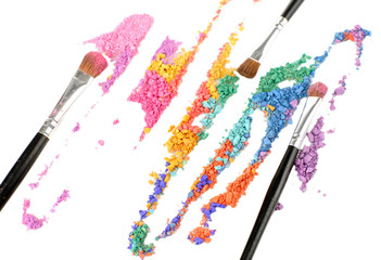 Fototapeta premium Crushed eyeshadow and professional make-up brush close up