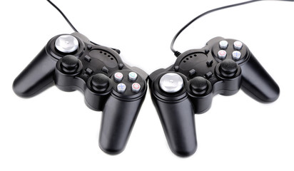Black game controllers isolated on white