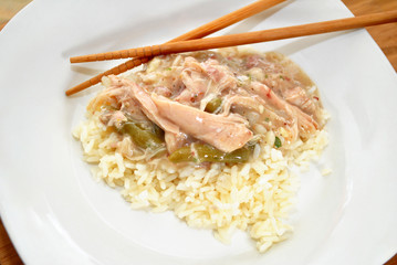 Chicken Gravy Served on White Rice with Chop Sticks