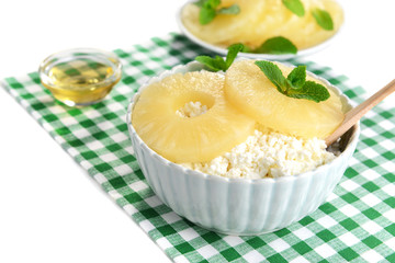 Bowl of tasty cottage cheese with pineapple, close up