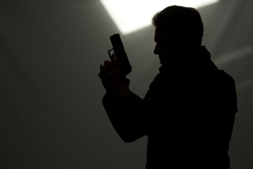 man killer policeman aiming gun