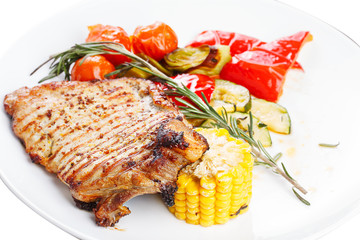 Hearty steak dinner. Grilled meat on a plate.