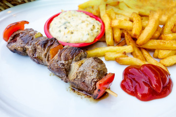 tasty grilled meat and vegetables skewers