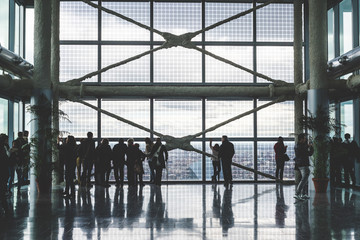 people silouette looking through windows