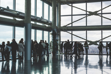 people silouette looking through windows