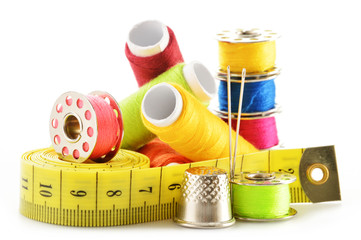 Composition with tailor needles and threads over white