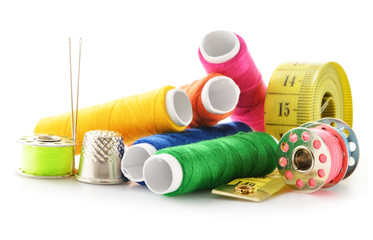 Composition with tailor needles and threads over white