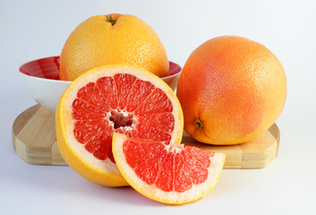 Juicy grapefruit on a cutting board.