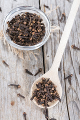 Cloves on a wooden spoon