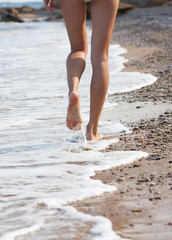 woman walking on the sand beach