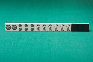 Smooth table surface with a mahjong on it