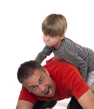 spoiled child on his father's back, parenting can be difficult