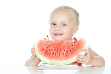 Little girl eating a watermelon on white