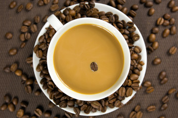 Obraz na płótnie Canvas Cup of coffee and coffee beans