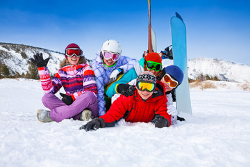 Fototapeta na wymiar Group of smiling snowboarders