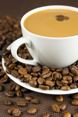 Cup of coffee and coffee beans
