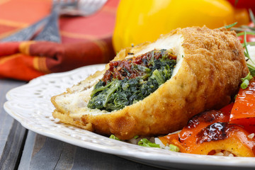 Chicken roll stuffed with spinach and dried tomatoes