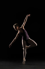 Fototapeta na wymiar Silhouette ballet dancer in black swimsuit