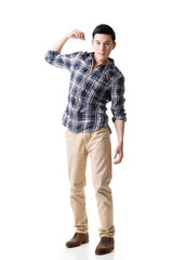 Naklejka premium Asian young guy carry or take something