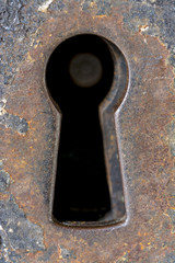 Jail cell door keyhole old and rusty