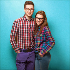 couple of guys dressed in clothes hipsters are in the studio