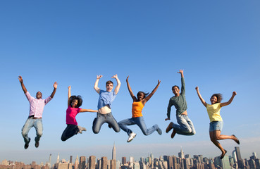 Group of Multi Racial People Jumping in the City