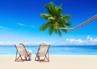 Couple Relaxing on the Tropical Beach
