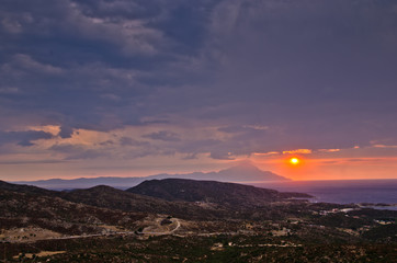 Obraz premium Stormy sky and sunrise at holy mountain Athos