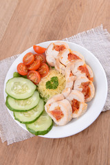 Delicious chicken roll on plate on table close-up