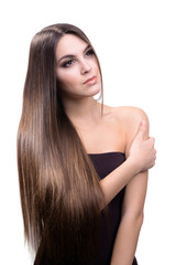 Naklejka premium Beautiful young woman with long hair isolated on white