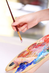 Artist paints picture close-up