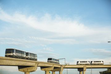 Sky trains traveling on rails to Phoenix Sky Harbor Airport