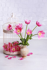 Beautiful pink tulips on grey wall background