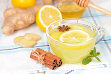 Healthy ginger tea with lemon and honey on table close-up