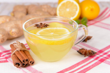 Healthy ginger tea with lemon and honey on table close-up