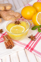 Healthy ginger tea with lemon and honey on table close-up