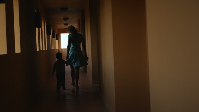 Mother and son in hotel hall