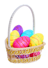 Easter Basket with Colorful Eggs isolated on white