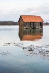 Barn surrounded with water