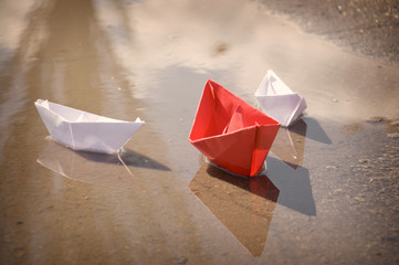 White red paper boats floating water spring
