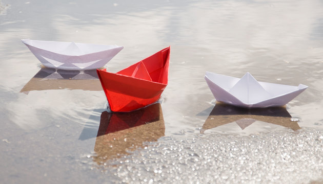 Colored Paper Boats In Water