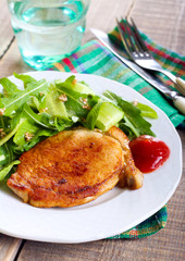 Fried pork chop and salad