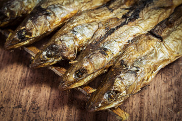 Grilled fishes on wood table.